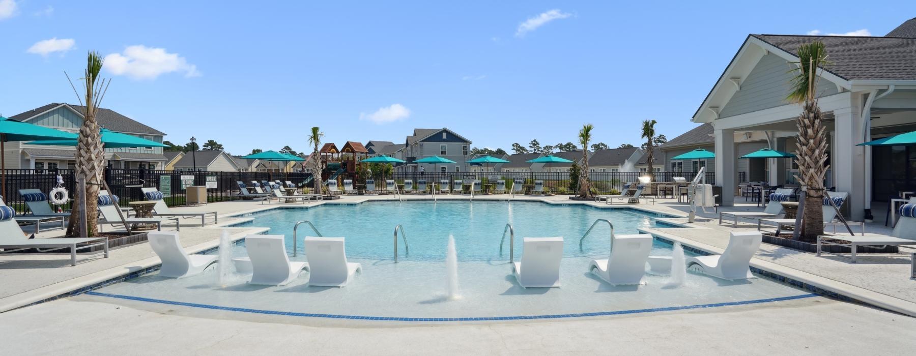 a pool with chairs around it