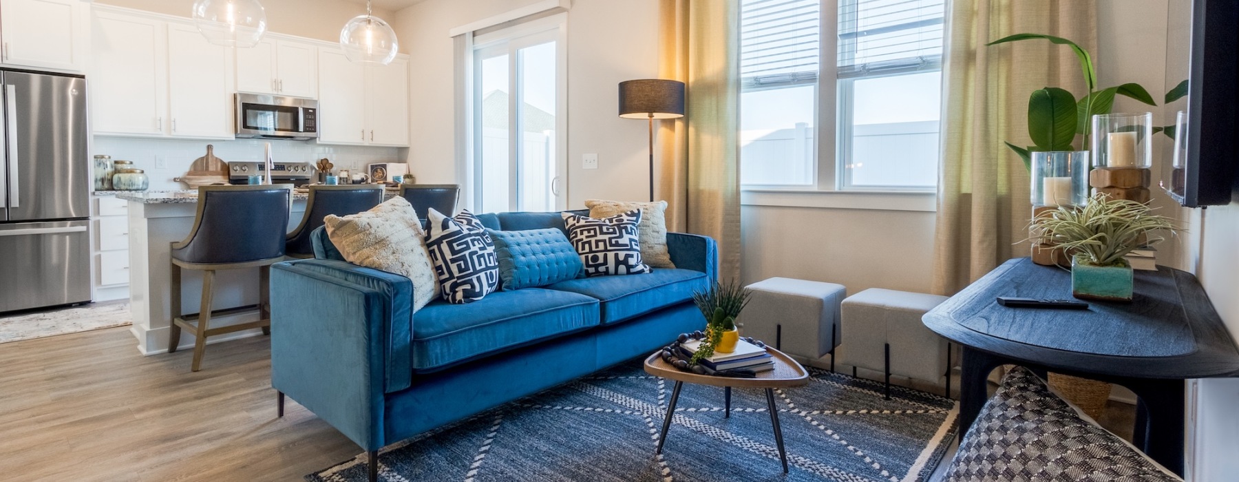 a living room with a blue couch