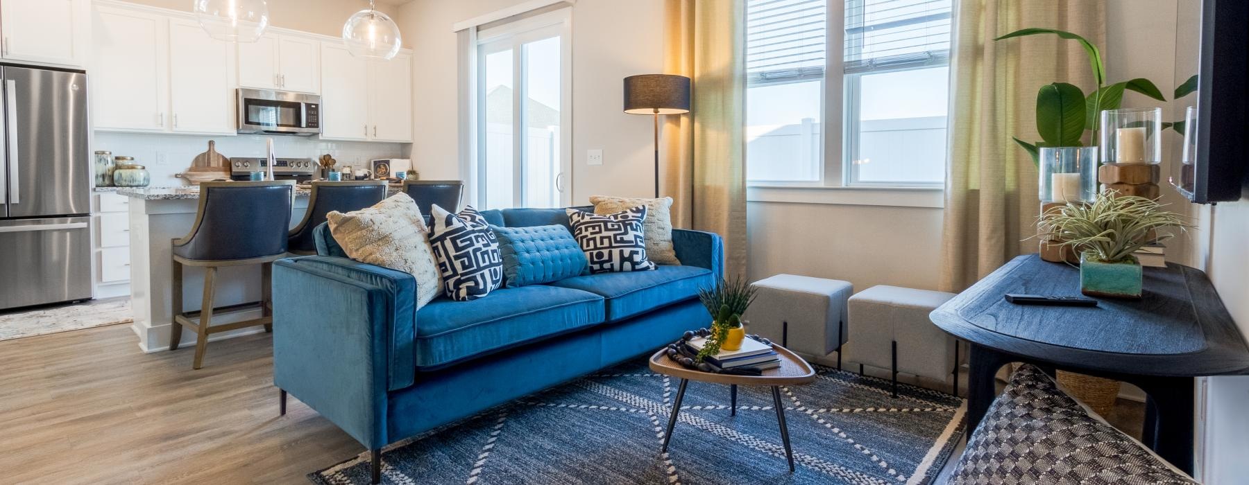 a living room with a blue couch